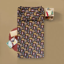 Patterned blanket with small items on a beige background