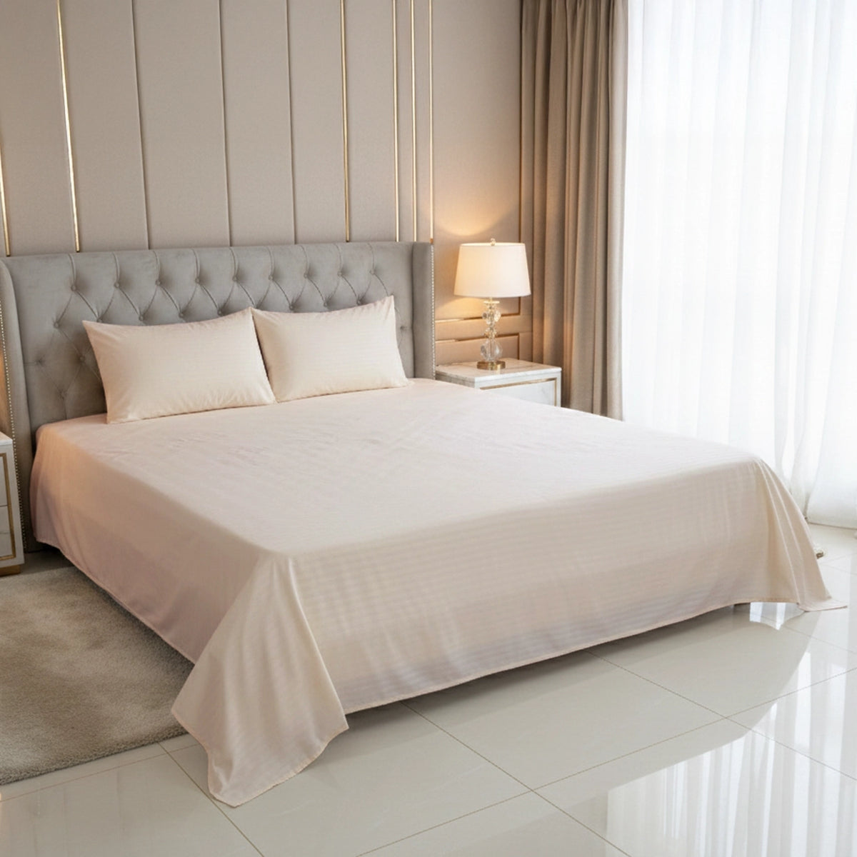 Neatly made bed with beige bedding in a well-lit bedroom.