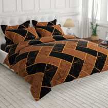 Bed with brown and black checkered comforter in a bedroom setting